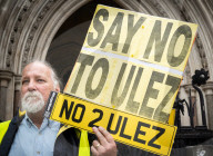 Stop ULEZ Coalition - a cross party campaign coalition formed to stop ULEZ outside The Royal Courts of Justice, London, UK.