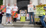 Stop ULEZ Coalition - a cross party campaign coalition formed to stop ULEZ outside The Royal Courts of Justice, London, UK.
