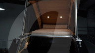 Flat bed accessory makes Musk Cybertruck ia mobile home.                                