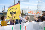 Portland Global Friendship Group at the gates to Portland Port waiting to welcome asylum seekers.