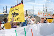 Portland Global Friendship Group at the gates to Portland Port waiting to welcome asylum seekers.