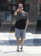 PREMIUM EXCLUSIVE Charlie Sheen Flashes An Infectious Smile Following Reunion With Producer Chuck Lorre