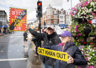 Anti-ULEZ protestors in Tooting Broadway London, Great Britain 
26th August 2023 

People campaigning to stop the ULEZ expansion which is due to commence on 29th August 2023 hold placards towards the traffic around Tooting Broadway