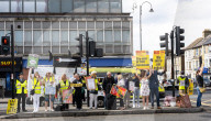 Anti-ULEZ protestors in Tooting Broadway London, Great Britain 
26th August 2023 

People campaigning to stop the ULEZ expansion which is due to commence on 29th August 2023 hold placards towards the traffic around Tooting Broadway