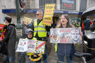 Anti-ULEZ protestors in Tooting Broadway London, Great Britain 
26th August 2023 

People campaigning to stop the ULEZ expansion which is due to commence on 29th August 2023 hold placards towards the traffic around Tooting Broadway