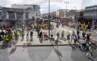 Anti-ULEZ protestors in Tooting Broadway London, Great Britain 
26th August 2023 

People campaigning to stop the ULEZ expansion which is due to commence on 29th August 2023 hold placards towards the traffic around Tooting Broadway