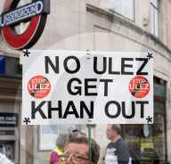 Anti-ULEZ protestors in Tooting Broadway London, Great Britain 
26th August 2023 

People campaigning to stop the ULEZ expansion which is due to commence on 29th August 2023 hold placards towards the traffic around Tooting Broadway