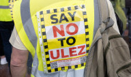 Anti-ULEZ protestors in Tooting Broadway London, Great Britain 
26th August 2023 

People campaigning to stop the ULEZ expansion which is due to commence on 29th August 2023 hold placards towards the traffic around Tooting Broadway