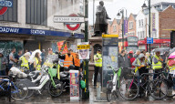 Anti-ULEZ protestors in Tooting Broadway London, Great Britain 
26th August 2023 

People campaigning to stop the ULEZ expansion which is due to commence on 29th August 2023 hold placards towards the traffic around Tooting Broadway