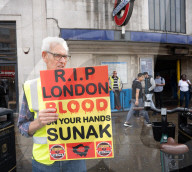 Anti-ULEZ protestors in Tooting Broadway London, Great Britain 
26th August 2023 

People campaigning to stop the ULEZ expansion which is due to commence on 29th August 2023 hold placards towards the traffic around Tooting Broadway