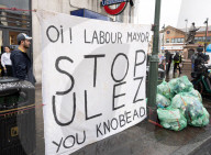 Anti-ULEZ protestors in Tooting Broadway London, Great Britain 
26th August 2023 

People campaigning to stop the ULEZ expansion which is due to commence on 29th August 2023 hold placards towards the traffic around Tooting Broadway
