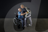 Power suit to help carers left and manouever patients