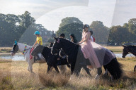 Annual fancy dress charity horse ride on Wimbledon common south west London, UK.