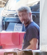 PREMIUM EXCLUSIVE Sean Penn Makes An Underwear Adjustment After Arriving At LAX