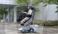 World's first wheelchair for climbing stairs and letting the user stand upright
