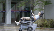World's first wheelchair for climbing stairs and letting the user stand upright