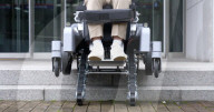 World's first wheelchair for climbing stairs and letting the user stand upright