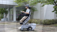World's first wheelchair for climbing stairs and letting the user stand upright