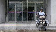 World's first wheelchair for climbing stairs and letting the user stand upright