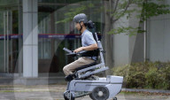 World's first wheelchair for climbing stairs and letting the user stand upright