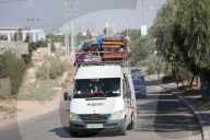 Palestinians with their belongings leave Gaza City as they flee from their homes following the Israeli army's warning, Gaza city, Gaza Strip, Palestinian Territory - 13 Oct 2023