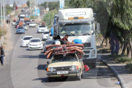 Palestinians with their belongings leave Gaza City as they flee from their homes following the Israeli army's warning, Gaza city, Gaza Strip, Palestinian Territory - 13 Oct 2023