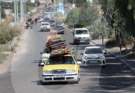 Palestinians with their belongings leave Gaza City as they flee from their homes following the Israeli army's warning, Gaza city, Gaza Strip, Palestinian Territory - 13 Oct 2023