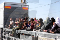 Palestinians with their belongings leave Gaza City as they flee from their homes following the Israeli army's warning, Gaza city, Gaza Strip, Palestinian Territory - 13 Oct 2023
