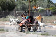 Palestinians with their belongings leave Gaza City as they flee from their homes following the Israeli army's warning, Gaza city, Gaza Strip, Palestinian Territory - 13 Oct 2023