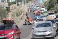 Palestinians with their belongings leave Gaza City as they flee from their homes following the Israeli army's warning, Gaza city, Gaza Strip, Palestinian Territory - 13 Oct 2023