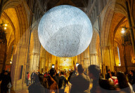 Museum of the Moon by Luke Jerram at Southwark Cathedral, London, UK.