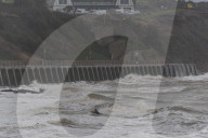 Surfers Enjoy Storm Babet in Folkestone, UK.