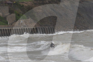Surfers Enjoy Storm Babet in Folkestone, UK.