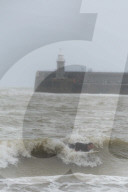 Surfers Enjoy Storm Babet in Folkestone, UK.