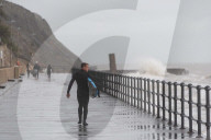 Surfers Enjoy Storm Babet in Folkestone, UK.