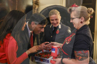 Prime Minister Rishi Sunak and his wife buy poppies