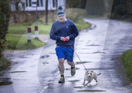 Former Prime Minister Boris Johnson jogging in Wallingford, UK.