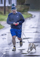 Former Prime Minister Boris Johnson jogging in Wallingford, UK.