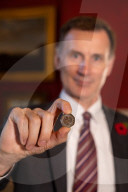 Jeremy Hunt UK Chancellor of the Exchequer showcases new coins of the nation