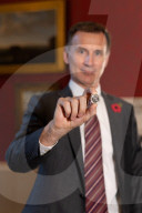 Jeremy Hunt UK Chancellor of the Exchequer showcases new coins of the nation