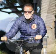 PREMIUM EXCLUSIVE Arnold Schwarzenegger riding bike after being SUED by cyclist