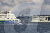 HMS Queen Elizabeth sails from Portsmouth, UK.