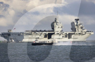 HMS Queen Elizabeth sails from Portsmouth, UK.