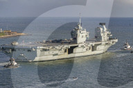 HMS Queen Elizabeth sails from Portsmouth, UK.