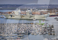 HMS Queen Elizabeth sails from Portsmouth, UK.