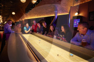 Shuffle board, axe-throwing and bingo: activity bar boom defies UK hospitality downturn
