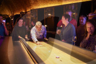 Shuffle board, axe-throwing and bingo: activity bar boom defies UK hospitality downturn