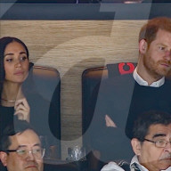 Harry and Meghan in good spirits at ice hockey game