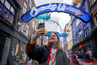 Christmas shoppers search for black friday deals, London, UK.