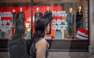 Christmas shoppers search for black friday deals, London, UK.